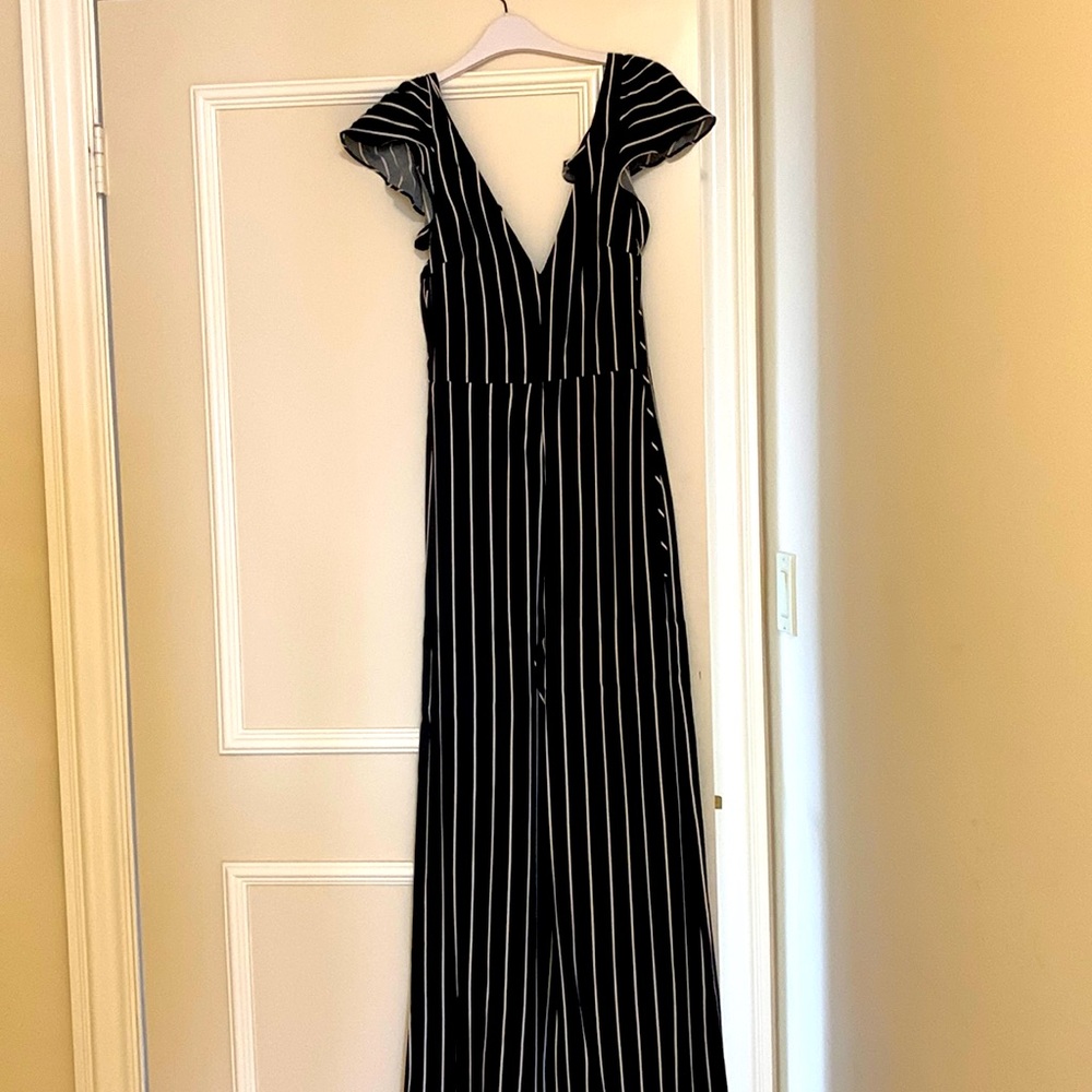 Reformation pinstriped jumpsuit in black with cream stripes